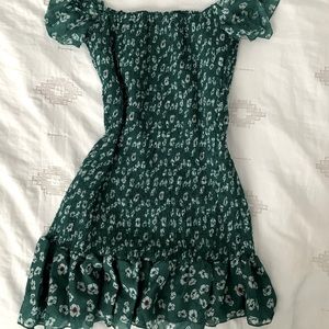 Green floral shirred mini dress w/flutter sleeves.